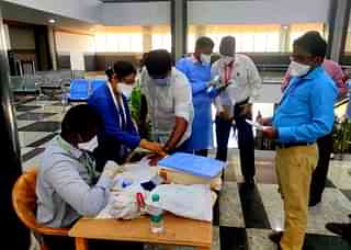 People flying from Covid affected nations being Quarantine stamped at Bengaluru Airport