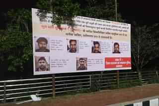 Hoardings displaying pictures, names and addresses of those who are required to pay damages to the state. (Picture: @AdminLKO)