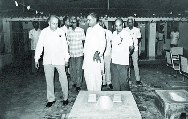 A demonstration of two-pit pour flush toilet developed by Pathak.  