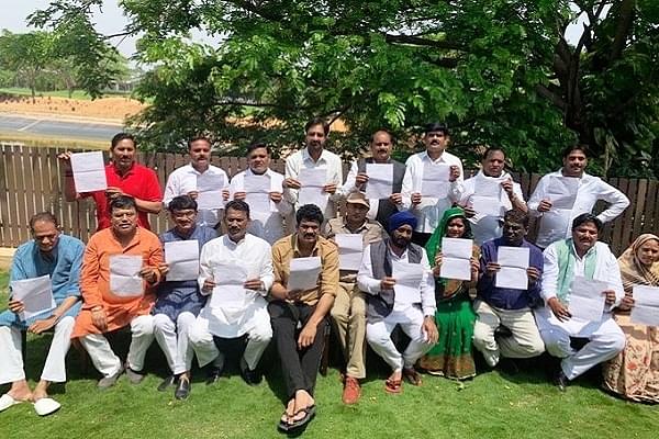 19 Congress MLAs holding their resignation letters in Bengaluru (@ANI/Twitter)