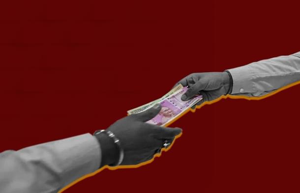 A bank employee receives loan repayment. 
