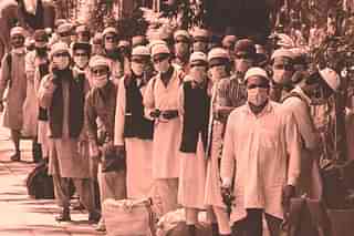 Tablighi Jamaat members being led to quarantine facilities (file photo)