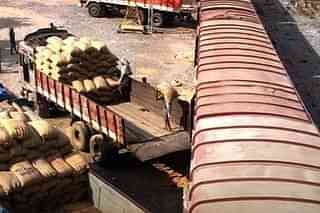 Gunny sacks being unloaded from an Indian Railways goods train. 