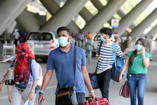 Passengers at an airport in India.