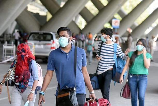 Passengers at an airport in India.