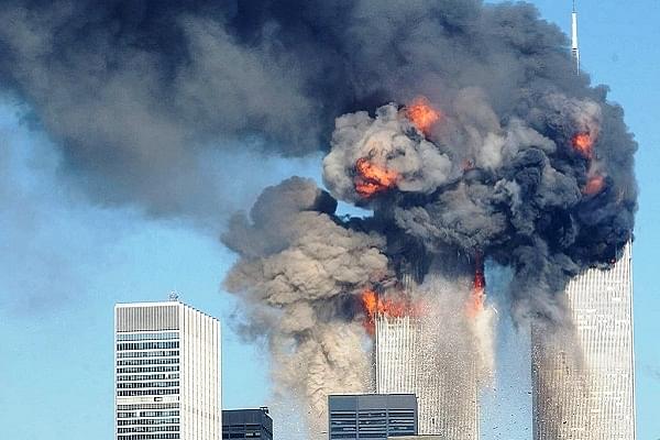 The World Trade Center buildings on fire after being hit by two planes on 11 September 2001, in New York. Photo: Spencer Platt/GettyImages.&nbsp; &nbsp;  &nbsp;
