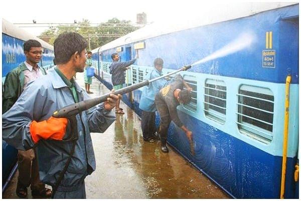 Indian Railways coaches being cleaned. 