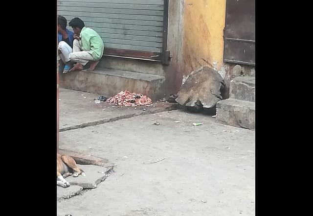 Pieces of meat lying in the street in Mohalla Kalibagh in West Champaran, Bihar.