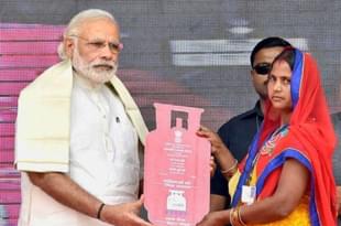 Prime Minister Narendra Modi distributing gas connections in Uttar Pradesh. 
