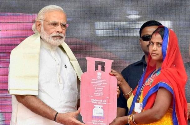 Prime Minister Narendra Modi distributing gas connections in Uttar Pradesh. 