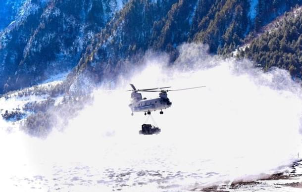 An Indian Chinook flying with an underslung payload.