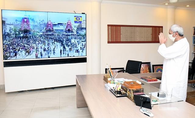 Odisha CM Naveen Patnaik pays obeisances to the deities through video-conferencing, from his office. &nbsp;