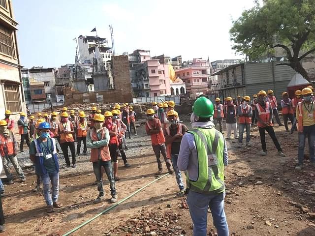 Workers at the Kashi corridor project