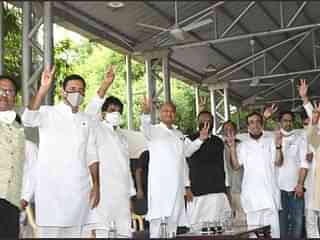 Rajastha CM Ashok Gehlot with party leaders and MLAs. (Twitter/@avinashpandeinc)