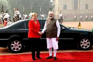 Prime Minister Narendra Modi with German Chancellor Angela Merkel. (PTI)
