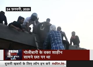 Screen grab from NDTV Prime Show of 5 March 2020 which shows Shahid Alam being brought down from roof by ladder.