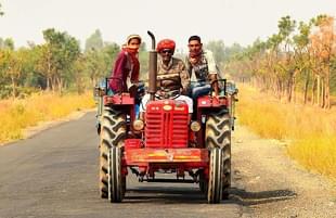 Farmer with a tractor (Clément Bardot/Wikicommons)