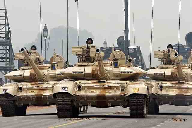 
Indian Army T-90 ‘Bheesma’ tanks roll through Janpath during 
rehearsals for the Indian Republic Day parade in New Delhi. (Photo Credit: RAVEENDRAN/AFP/Getty Images)

