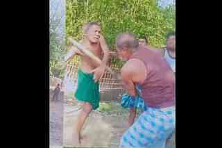 A photograph of the assault as shared by the Dalit family. Sarvlal Harijan is in green lungi.