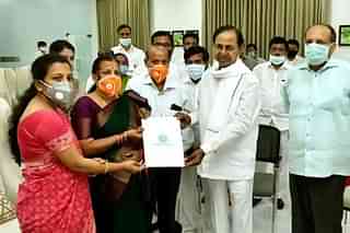 CM KCR handing over appointment letter to Santoshi (Pic via https://twitter.com/TelanganaCMO)