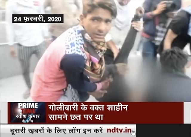 Screen grab from NDTV Prime Show, 5 March 2020 which shows Shahid Alam being carried by his fellow rioters.