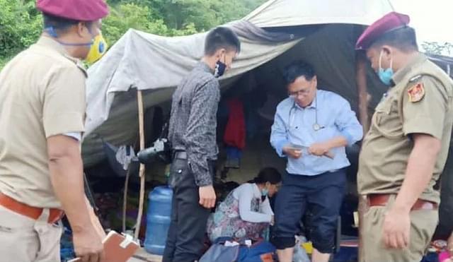 Dr Z R Thiamsanga (in blue shirt) after attending to a security personnel in a remote area. (Picture: Twitter/@dipr_mizoram)