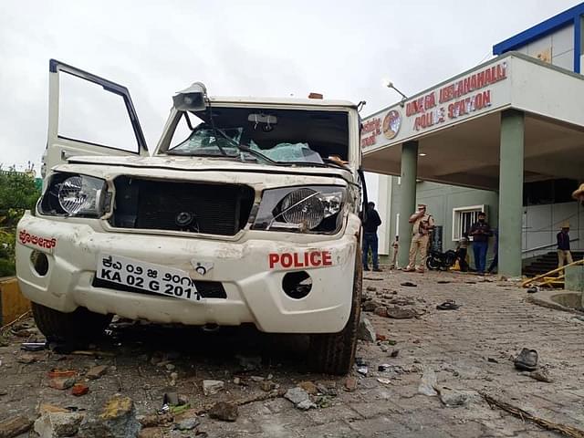 Vandalised police vehicle and station in Bengaluru violence