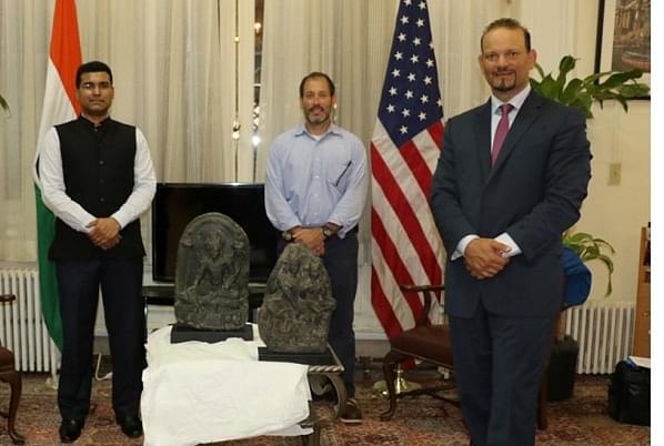 Officials of the US and Indian establishments, with the idols. 