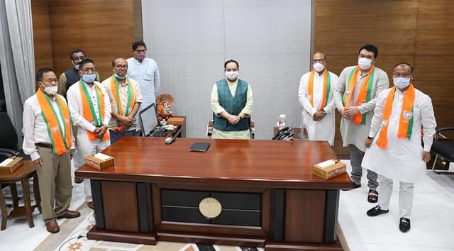 Ex-Congress MLAs who joined the BJP today with party president J P Nadda and other leaders. (Twitter/@NBirenSingh)