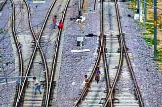 Children playing on rail tracks.&nbsp;