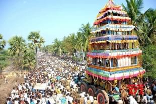 Sri Lakshmi Narasimha Swamy Temple chariot being pulled by devotees during a festival.