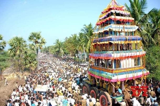 Sri Lakshmi Narasimha Swamy Temple chariot being pulled by devotees during a festival.
