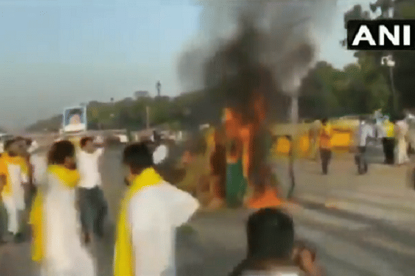 Tractor being burnt by Punjab Youth Congress workers (ANI)