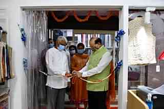 KVIC Chairman inaugurating the outlet at SPG Colony in Delhi.