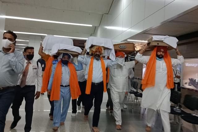 DSGMC in association with World Punjabi Organization brought 182 Afghan Hindu-Sikh migrants to India from Afghanistan in a chartered flight today at 4:30 PM at New Delhi (Source: @mssirsa/Twitter)