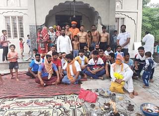 A picture after the ‘ghar wapsi’ event in Aasan Kalan. The shirtless men in Janeu are the new converts