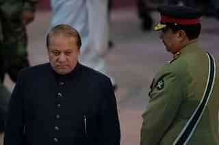 Nawaz Sharif  walks past Raheel Sharif (AAMIR QURESHI/AFP/GettyImages)