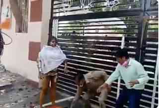 A still from the video showing the woman attempting self-immolation&nbsp;