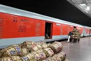 Produce being loaded on to a Kisan Rail.