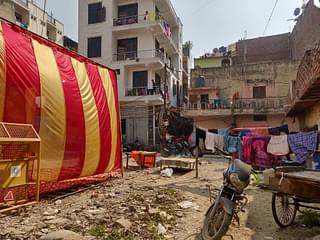 A view of building where Bhagat Lal lives from a cluster of jhuggis where Dildar and Soni’s parents live