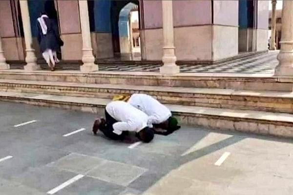 Alleged image of Faisal Khan and Chand Mohammad offering Namaz at Mathura Temple (Twitter)