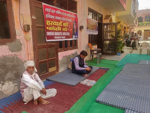 Outside Nikita’s house. Picture clicked on 3 November. The man sitting in black jacket is Moolchand Tomar