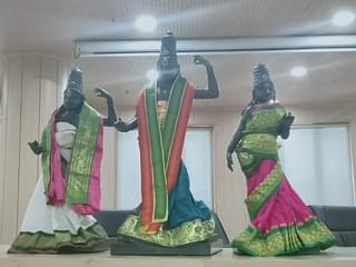 The idols dressed in traditional attire.