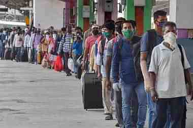 Migrants at a railway station to board trains for their native places, fearing another lockdown.