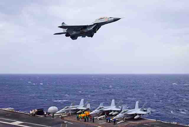 Indian Navy MiG-29K flies over USS Nimitz during Malabar Naval Exercise