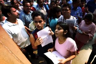 Students check NEET medical entrance exam results. (Raj K Raj/Hindustan Times via GettyImages)
