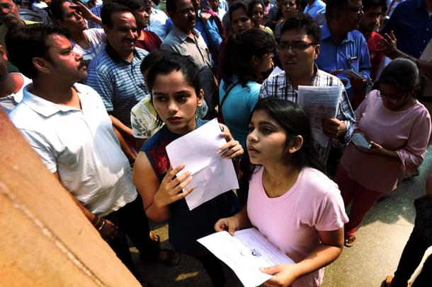 Students check NEET medical entrance exam results. (Raj K Raj/Hindustan Times via GettyImages)