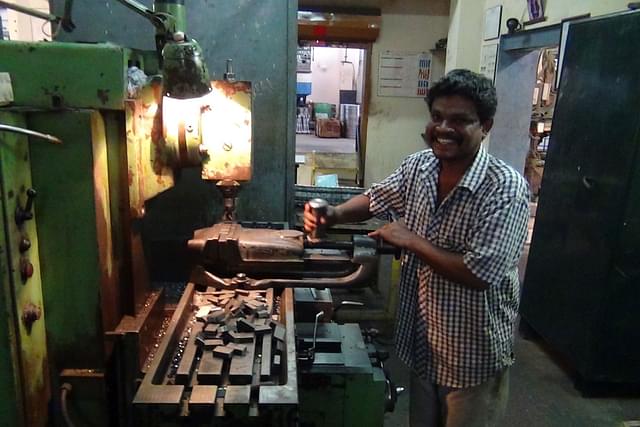 Employee at Work in Newall Engineering, Chennai (Flickr)