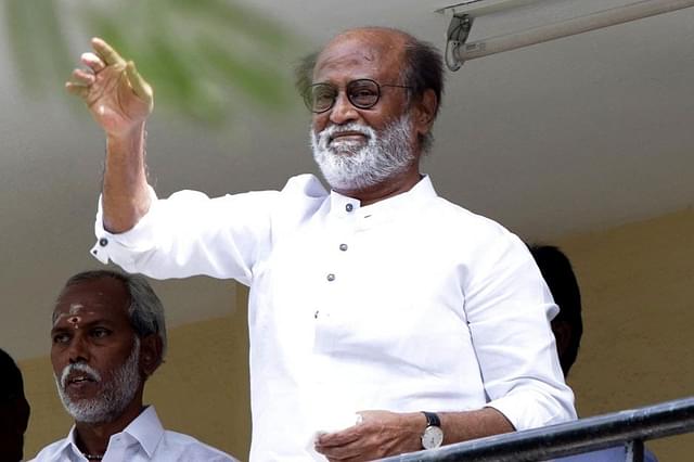 Superstar Rajinikanth waves at his supporters from the balcony of his house in Poes Garden.&nbsp;