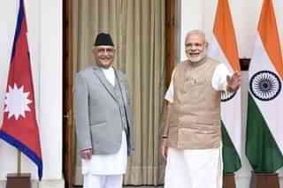 Prime Minister Narendra Modi (R) with Nepal Prime Minister Khadga Prasad Sharma Oli  in New Delhi in 2016. (Sonu Mehta/Hindustan Times via Getty Images)